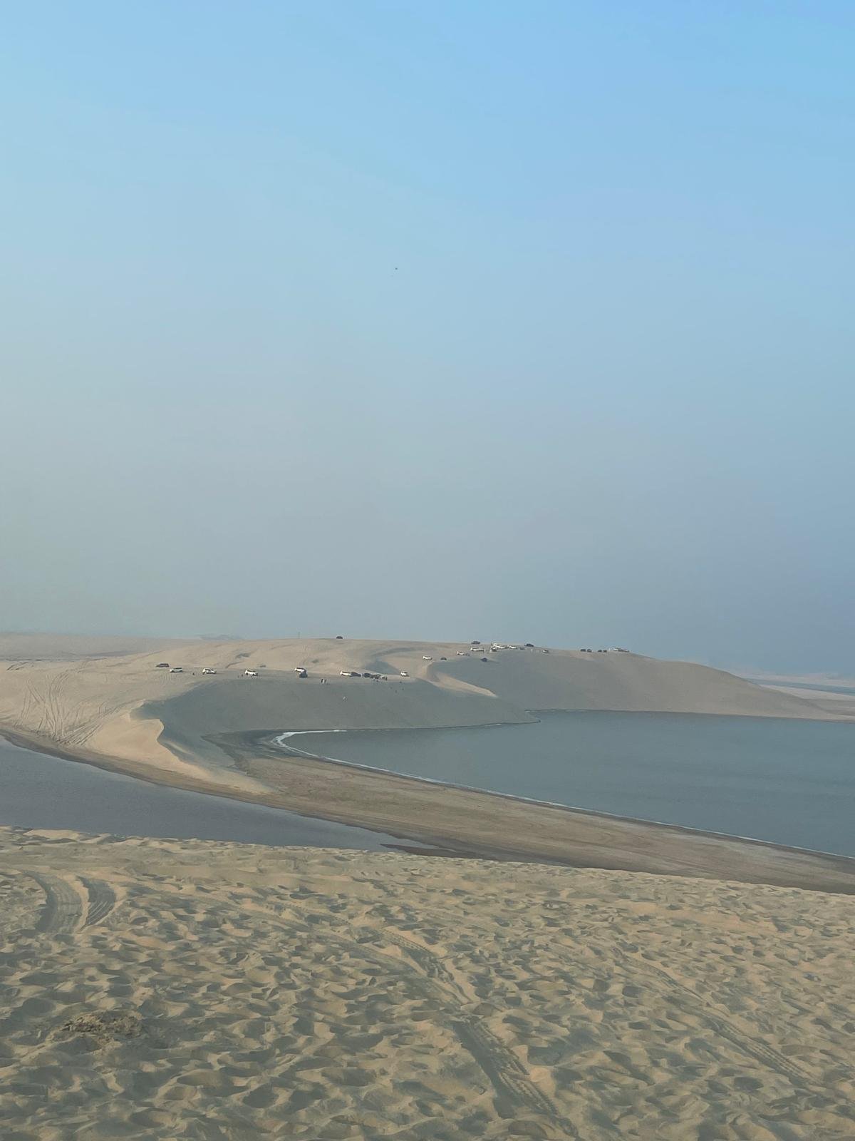 The Inland Sea meeting the dunes under a pale morning sky